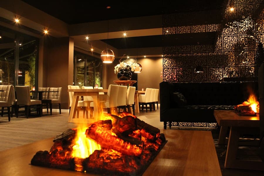 Warmly lit interior of MCHI restaurant in Amsterdam
